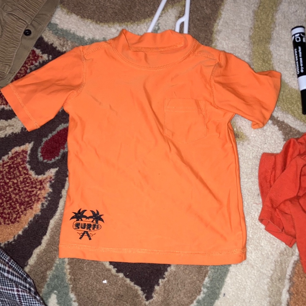 Two T-shirts 1 pair of navy blue shorts. Size 12M